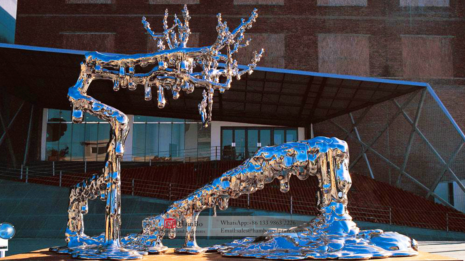 Real estate stainless steel wave sculpture